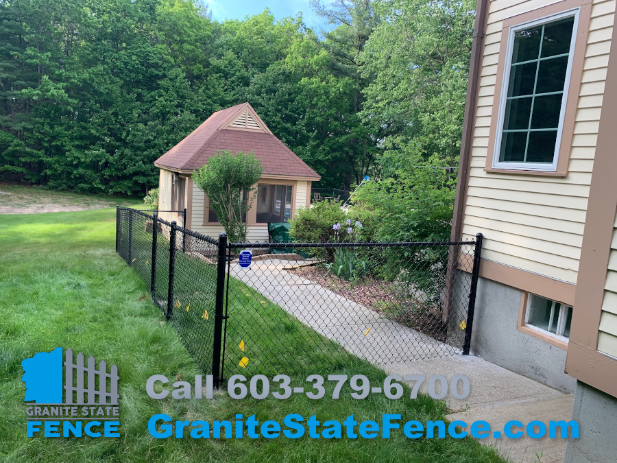 Black vinyl coated chain link fence installed in Windham, NH.