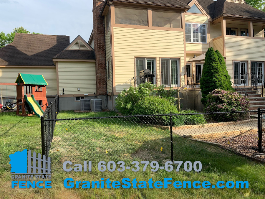 Black vinyl coated chain link fence installed in Windham, NH.