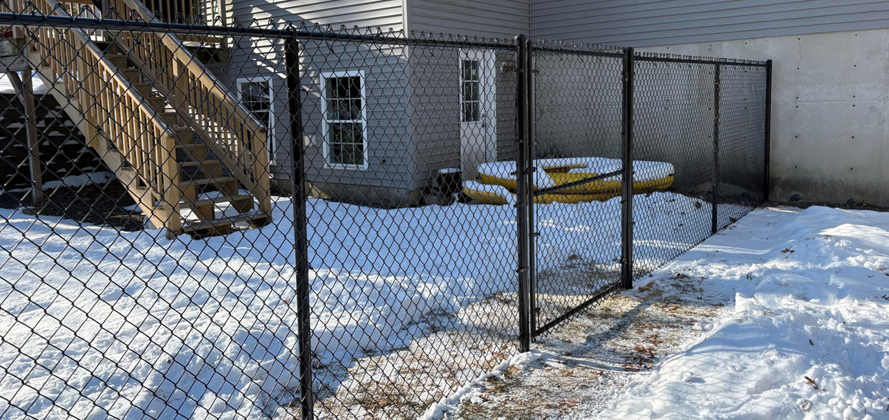 Black Chain Link Fence Installation in Salem, NH by Granite State Fence