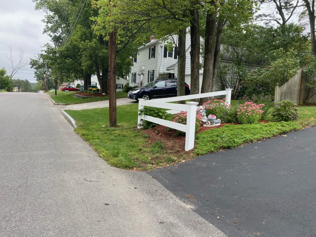 We installed White Vinyl 2 rail ranch fencing for this front yard in Manchester, NH.