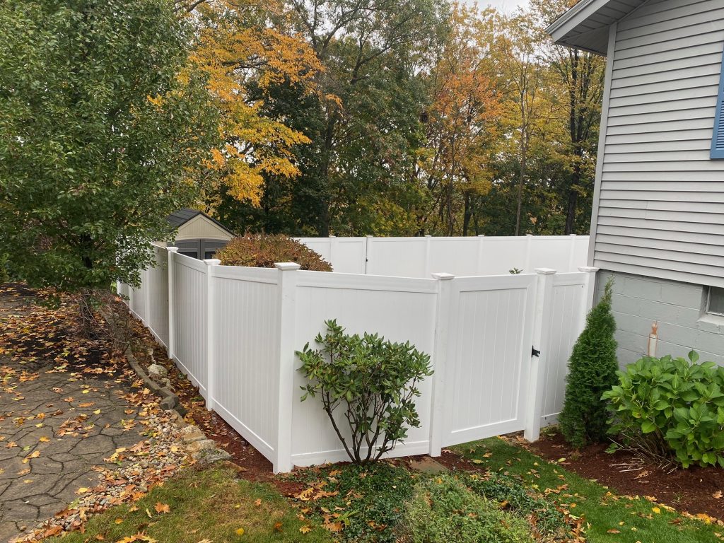 White Vinyl Privacy Fence installed in Manchester, NH.