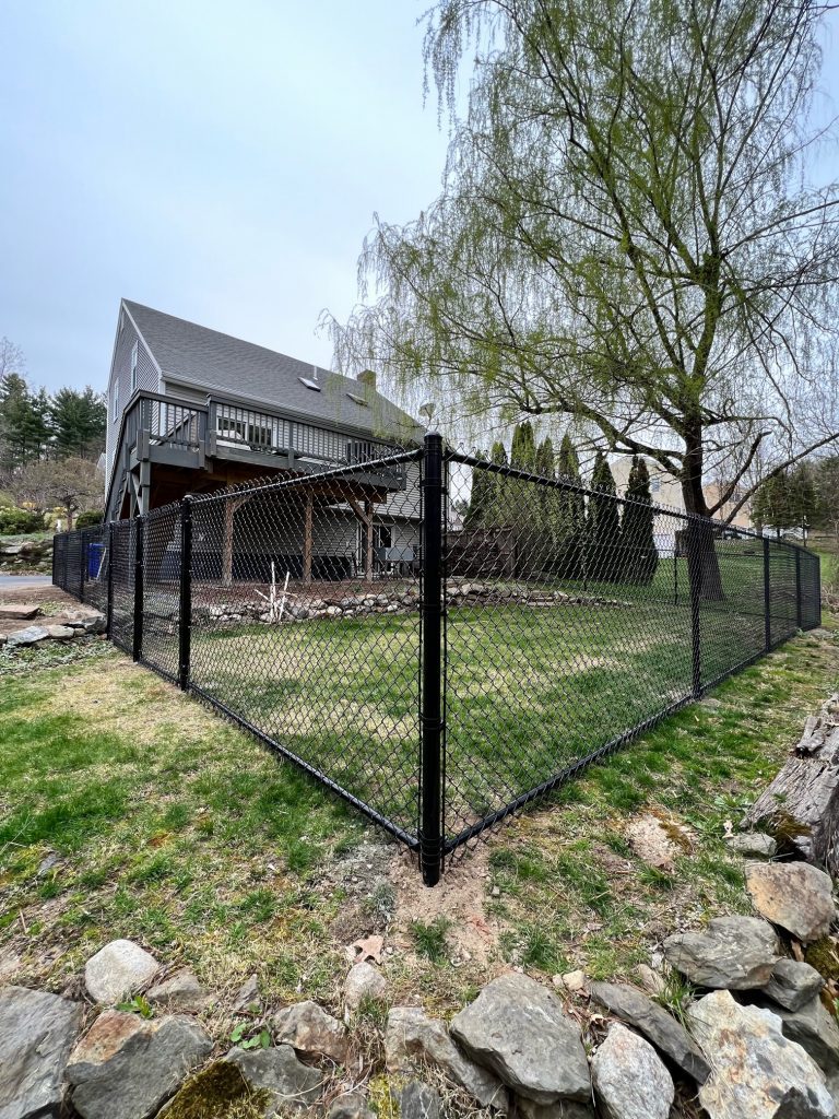The crew from Granite State Fence installed 4' Chain Link fencing with bottom rail for this property in Hudson, NH.