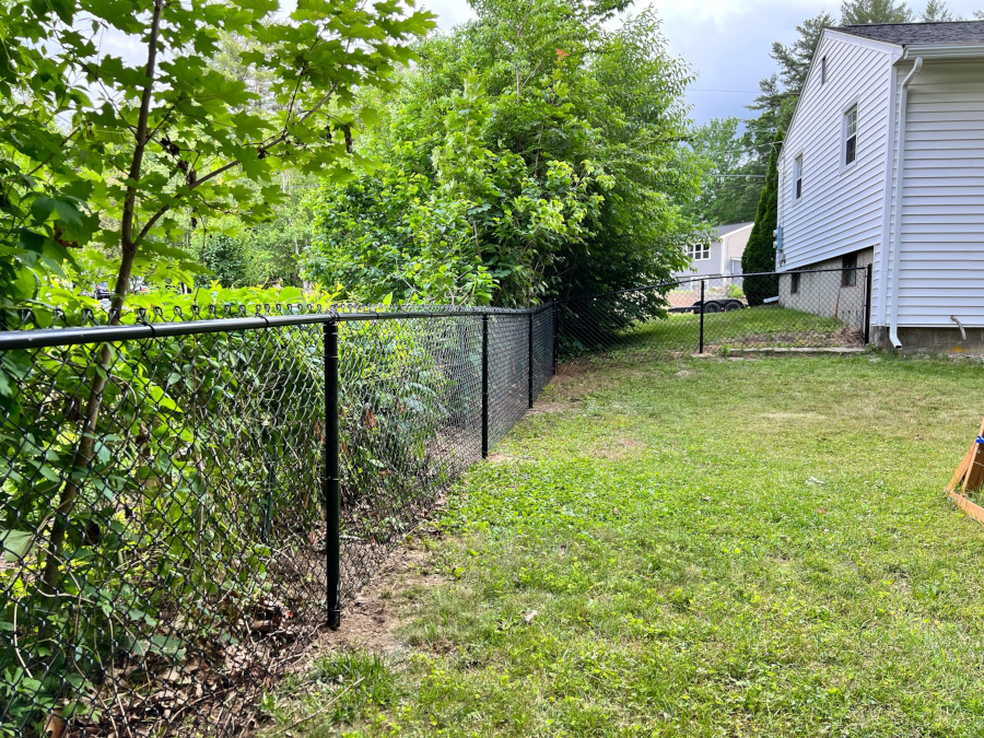  Granite State Fence installed 4" black chain link fencing for this property in Goffstown, NH.