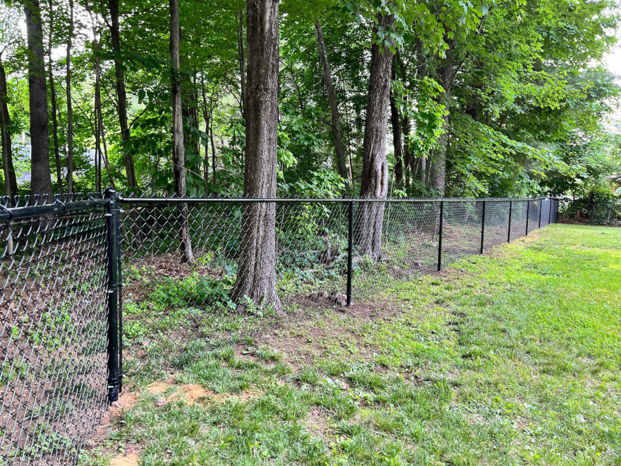  Granite State Fence installed 4" black chain link fencing for this property in Goffstown, NH.
