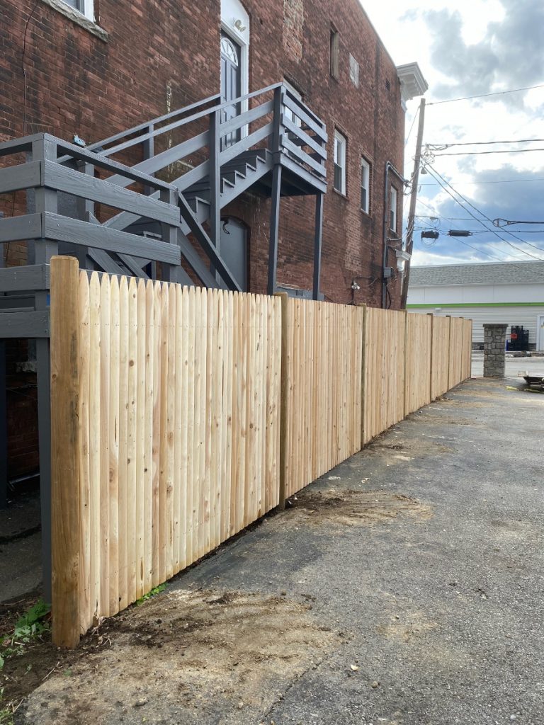 Commercial Stockade Fencing installed in Derry, NH.