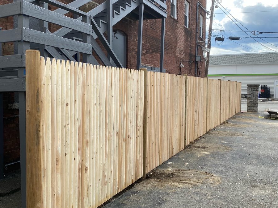 Commercial Stockade Fencing installed in Derry, NH.