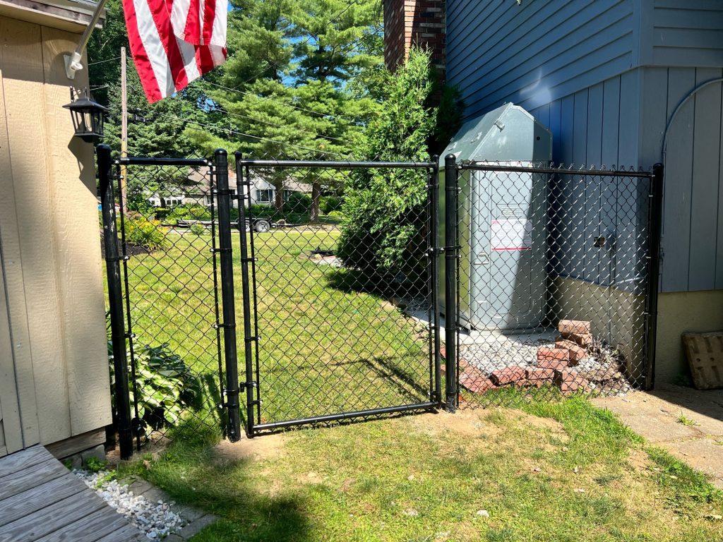 Black Chain Link Fencing Installation in Salem, NH.