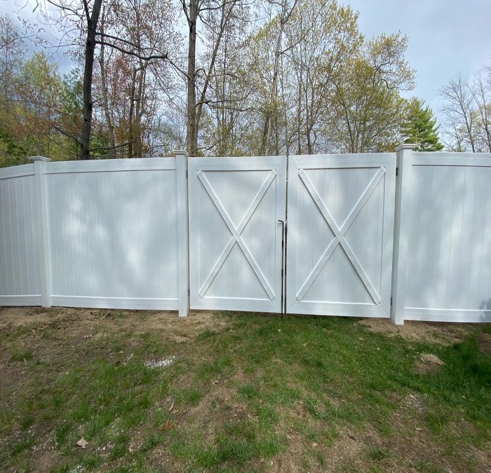 White Vinyl Fence installation in Windham, NH.