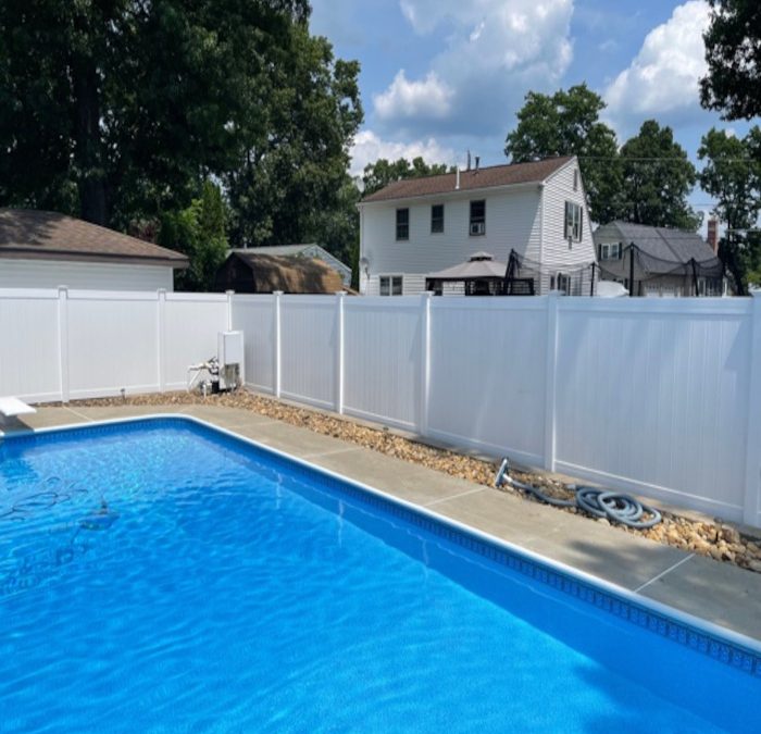 White Vinyl Fencing and Chain Link Fencing installed in Nashua, NH