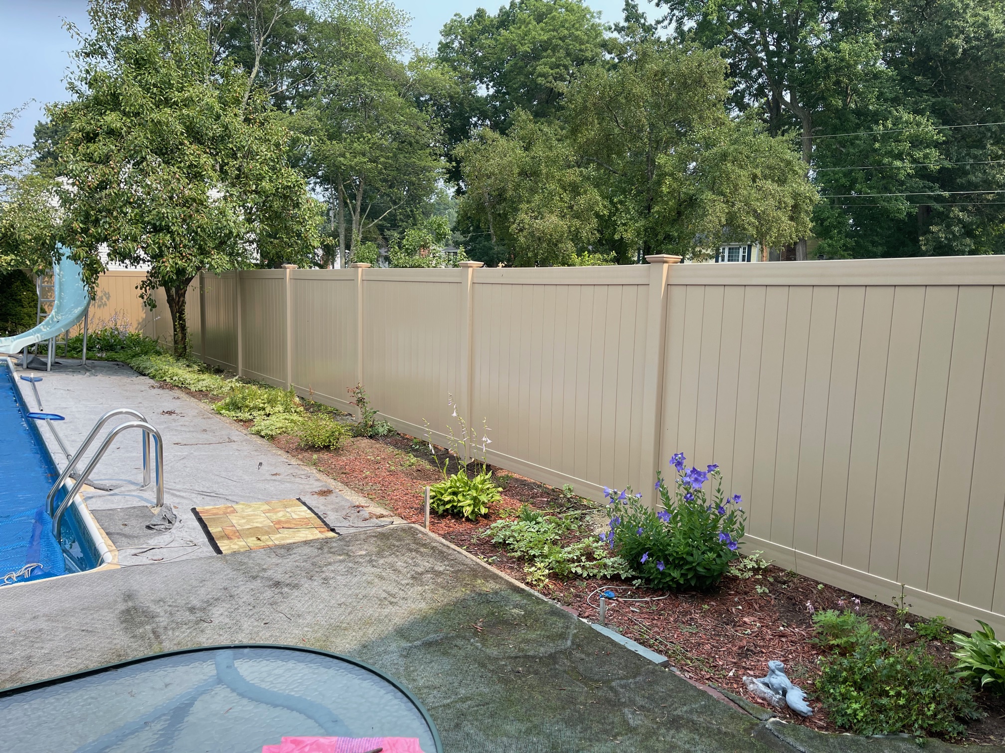 Beige Vinyl Privacy Fence installed in Salem, NH | Granite State Fence